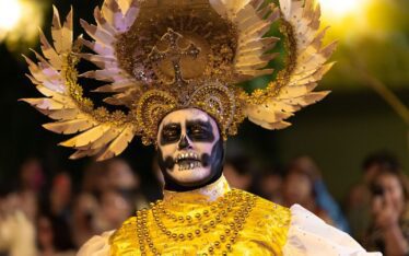 Stunning Day of the Dead costume at a colorful parade in Merida, Yucatan, Mexico.